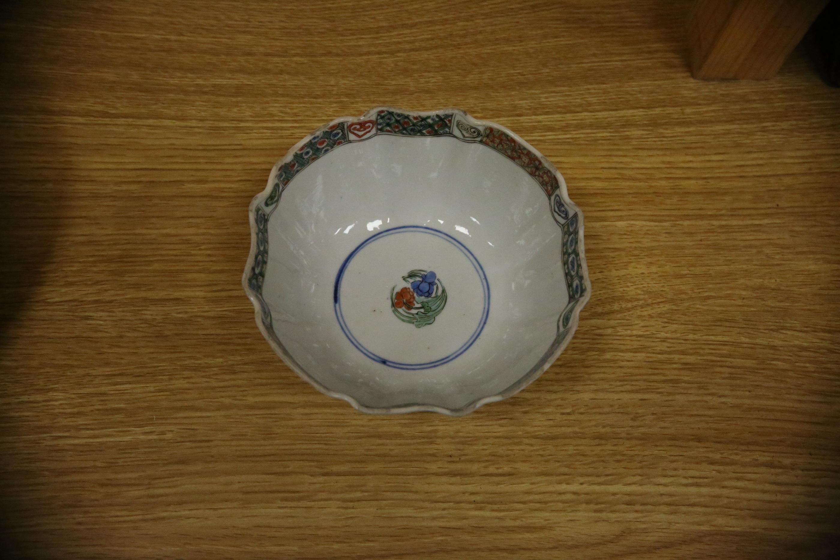 A Chinese famille verte powder blue ground bowl and a similar dish, both Kangxi period, 27.5cm diameter. Condition - dish poor, bowl fair